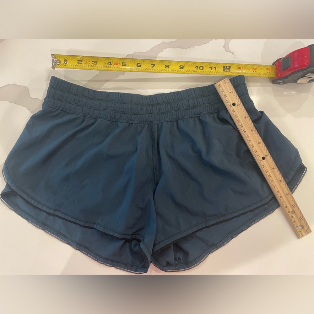 Lululemon women’s shorts with liner, dark teal color.